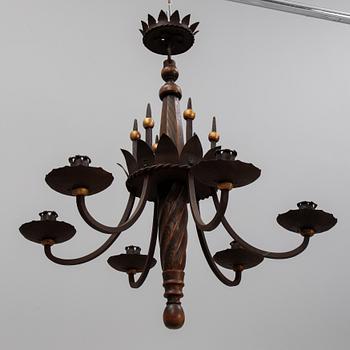 An iron and oak chandelier, 20th Century.
