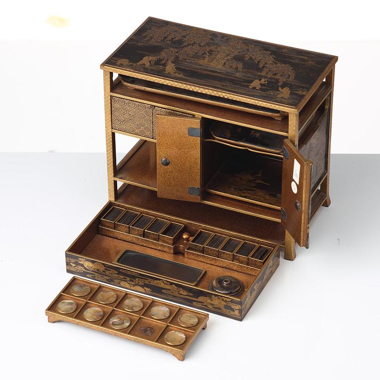 A Japanese miniture lacquer cabinet, Meiji period (1868-1912).