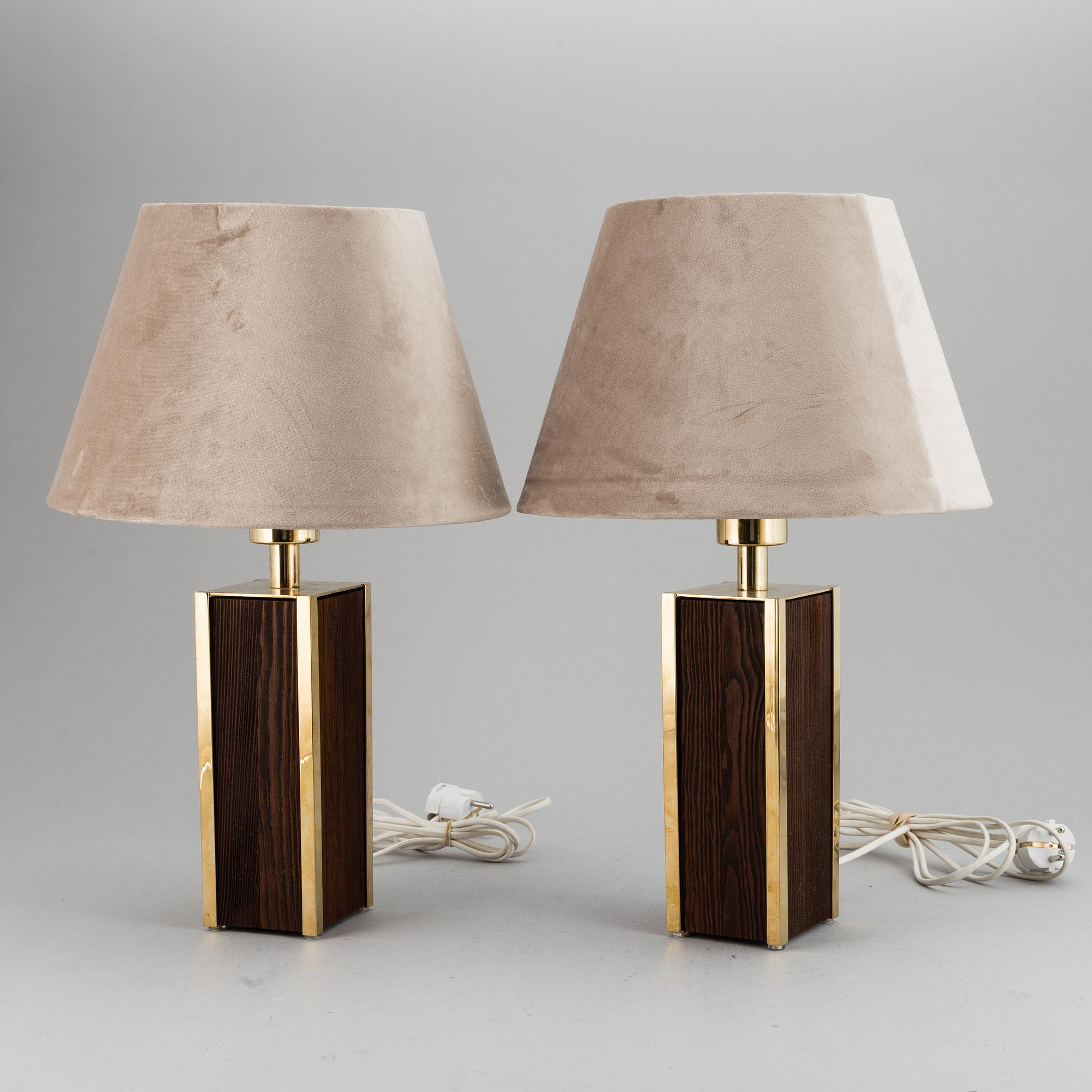 A second half of the 20th Century pair of pine and brass table lights.