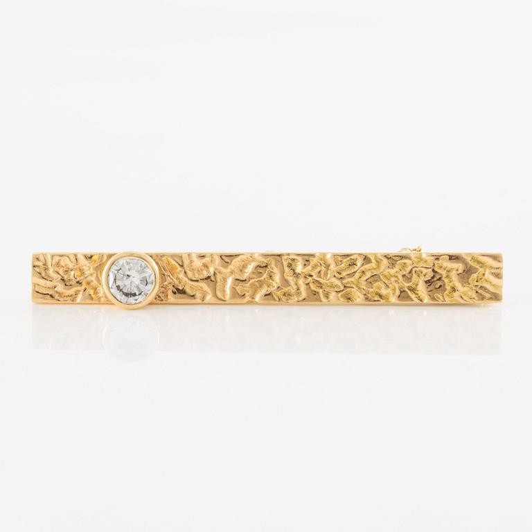 Tie pin 18K gold with a round brilliant-cut diamond, 0.70 ct according to engraving.