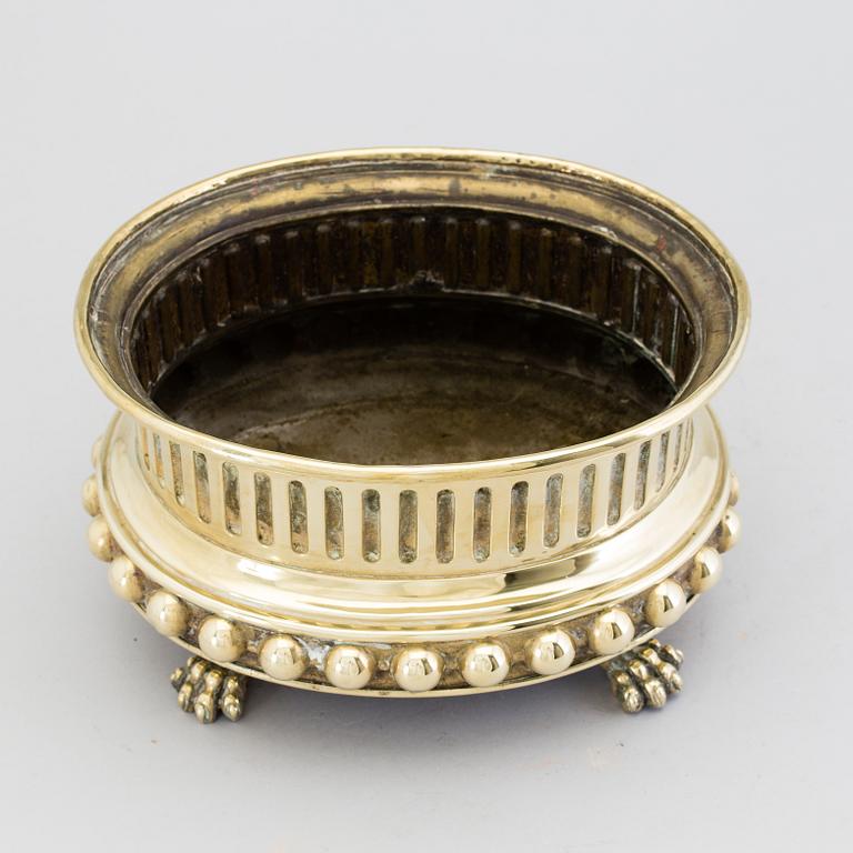 A mid 1800s brass flower pot.