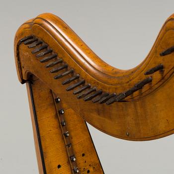 A birch and pine harp from Northern Europe, first half of the 19th century.