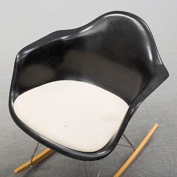 A 'Rocket chair' by Charles & Ray Eames, Herman Miller, late 20th century.