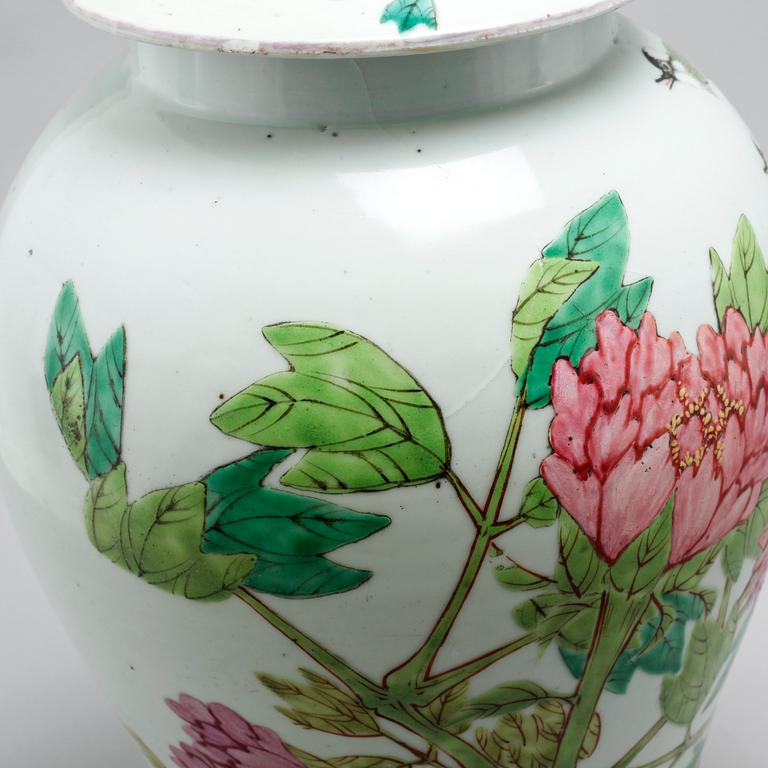 Two similar 20th century porcelain jars with lids.