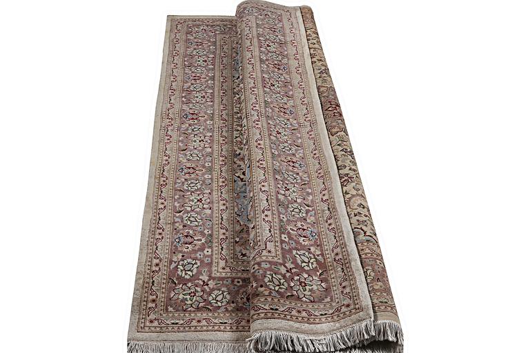 A carpet, Oriental, part silk, c. 283 x 185 cm.