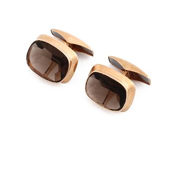 MANSCHETTKNAPPAR, 14K guld med fasettslipad rökkvarts, stämplade RL, Turku, Finland, 1967. Vikt 7,3 g.