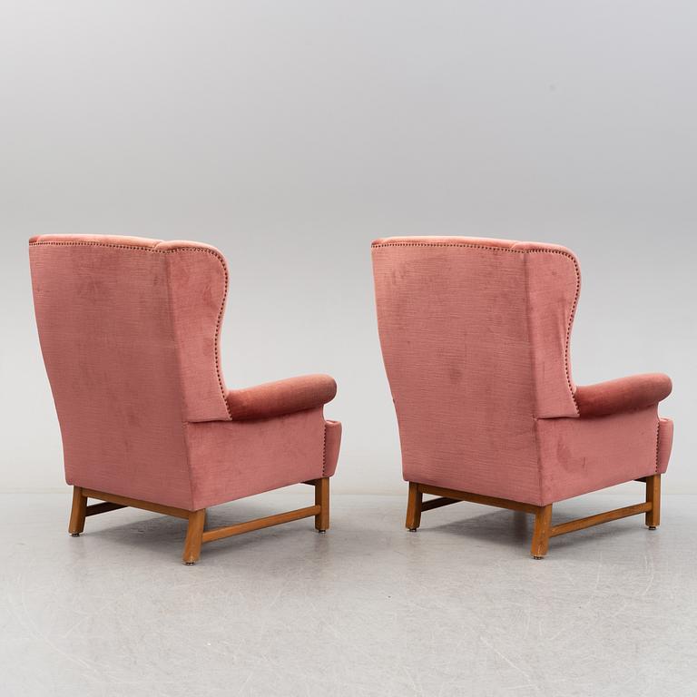 A pair of model 3543 'Oxford' easy chairs by Ragnar Helsén, Svenskt Tenn.
