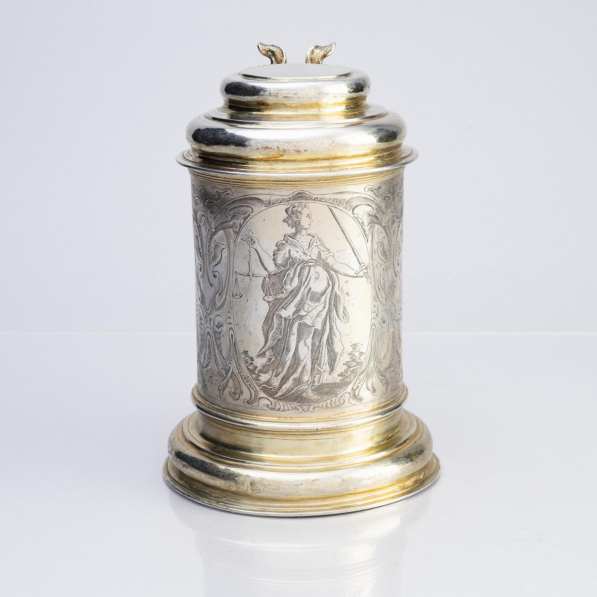 A German parcel-gilt silver tankard, mark of Walter Kopman, Hamburg (1649-1688).