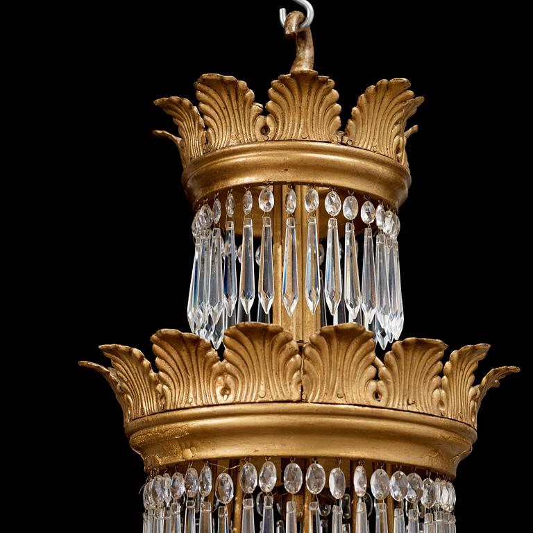 A German 19th century sixteen-light chandelier in the manner of Karl Friedrich Schinkel.