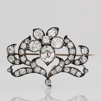 BROSCH/HÄNGE med gammalslipade diamanter totalt ca 16.00 ct.