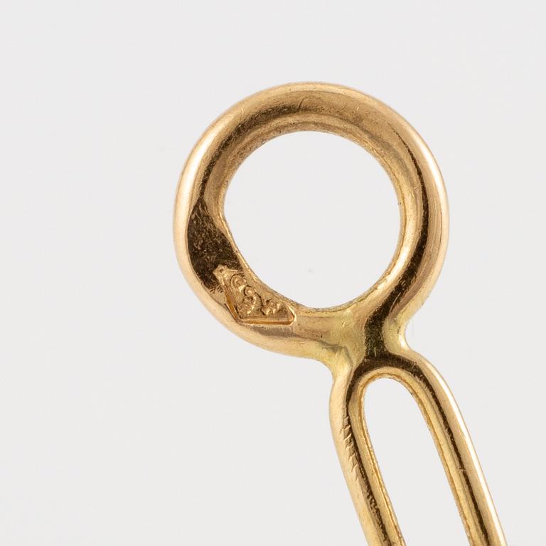 A Cartier necklace 18K multi-coloured gold "Trinity" cross.