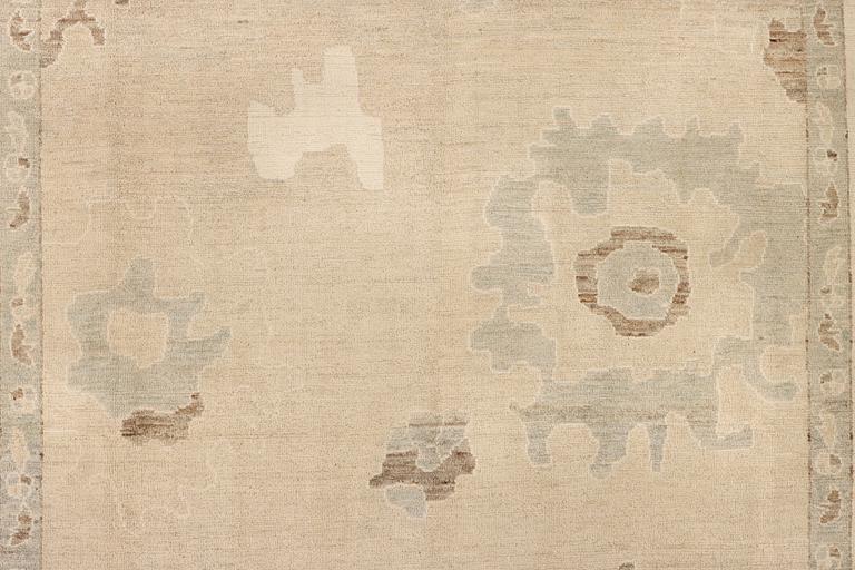 An Ushak design carpet, a. 426 x 307 cm.