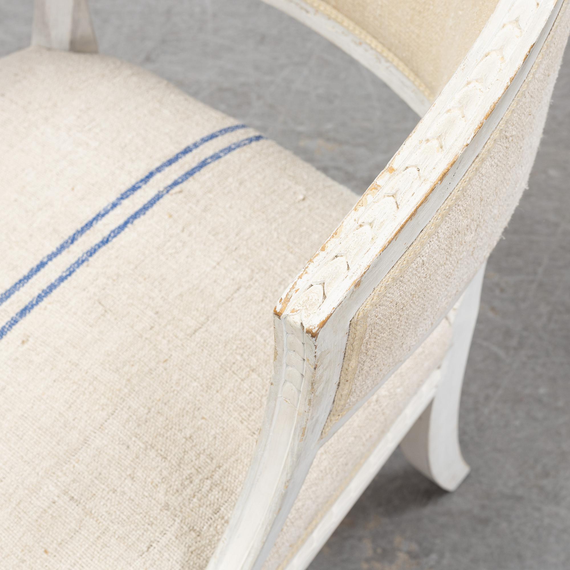 A pair of Gustavian style armchairs from around year 1900.