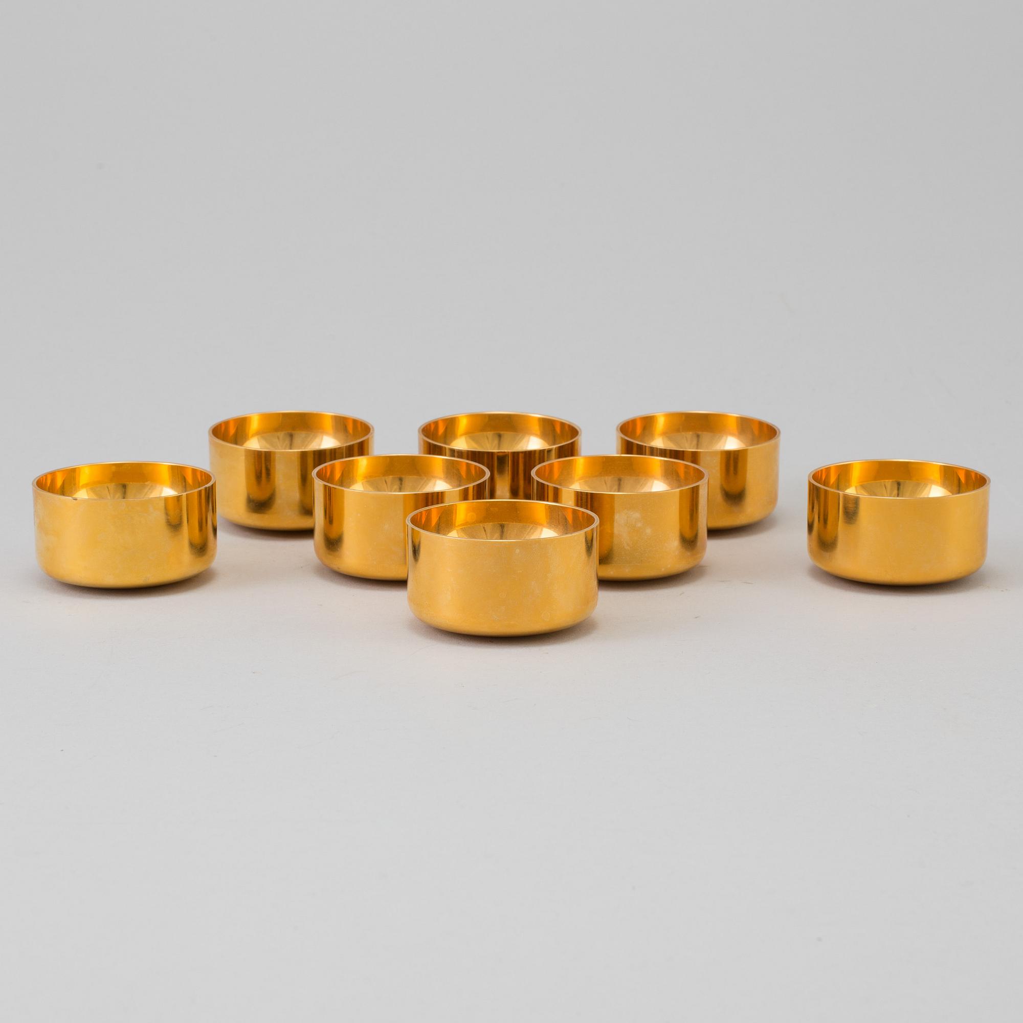A set of eight brass drinking cups by PIERRE FORSSELL for Skultuna, Sweden.