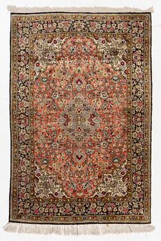 A Ghom silk rug, c. 158 x 105 cm.