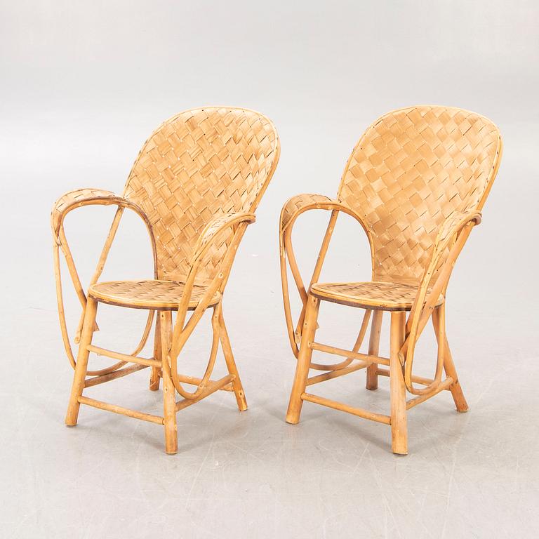 A pair of Pascal Raffier "Le Corbusier" chestnut chairs France late 20th century.