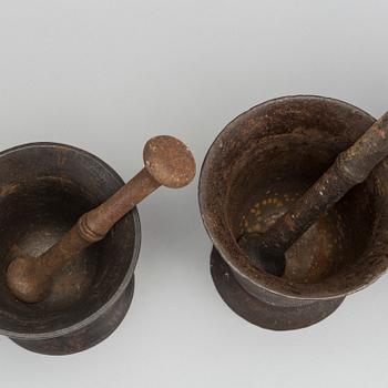 A set of three cast iron mortars around 1900.