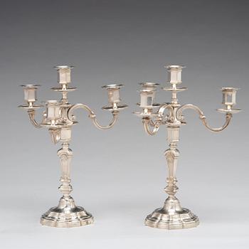 A pair of French 20th century silver 950/1000 four light candelabra, marked Mon Odiot.