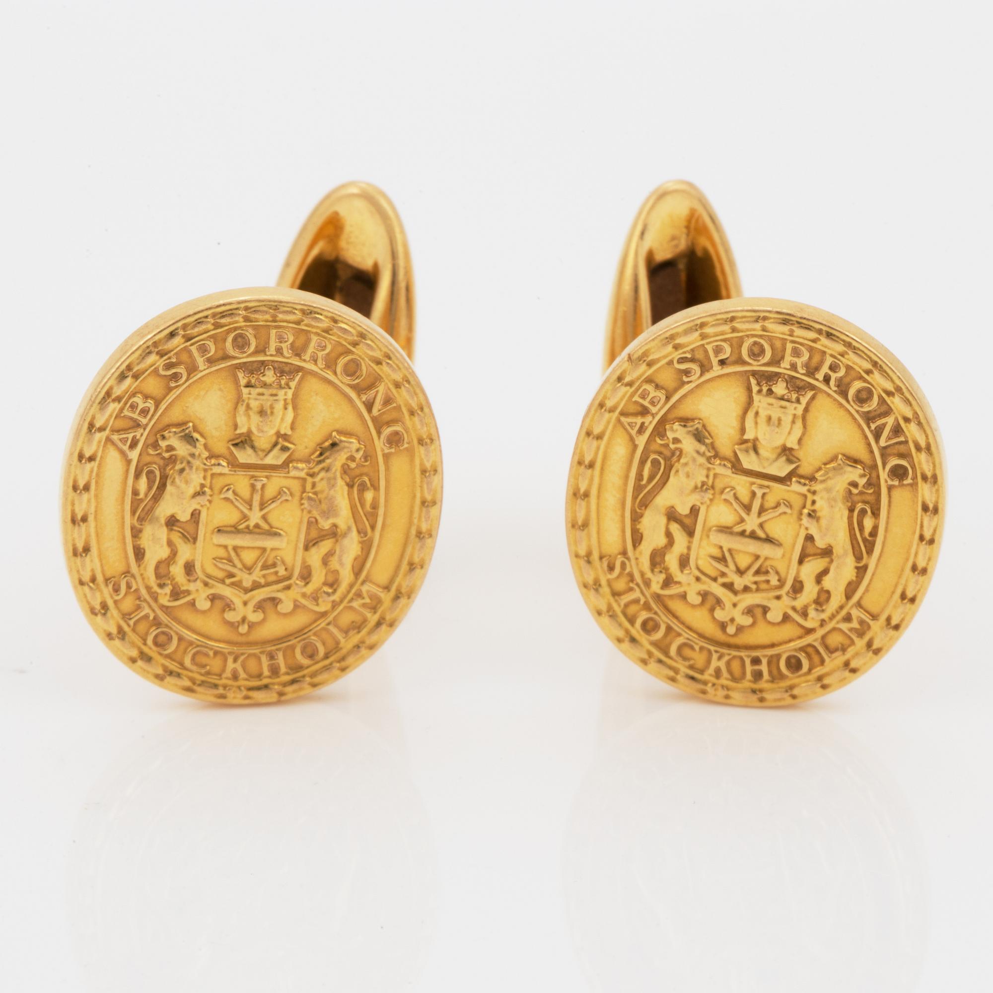 MANSCHETTKNAPPAR, Sporrong, 18K guld.