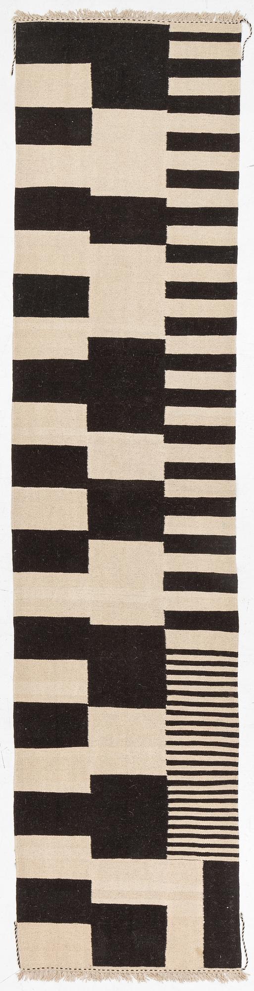 A kilim runner, c. 393 x 93 cm.