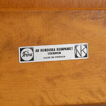 Bengt Ruda, a beech wood  armchair with footstool, with new sheepskin upholstery, for Nordiska Komapniet, 1950s.