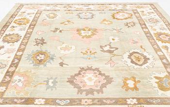 A Sultanabad/Ushak design carpet, signed Halil, c. 389 x 295 cm.