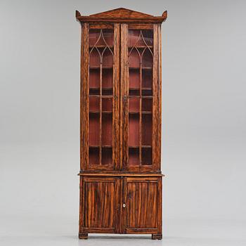 A Swedish faux-boix neo-gothic book cabinet, ca 1830.