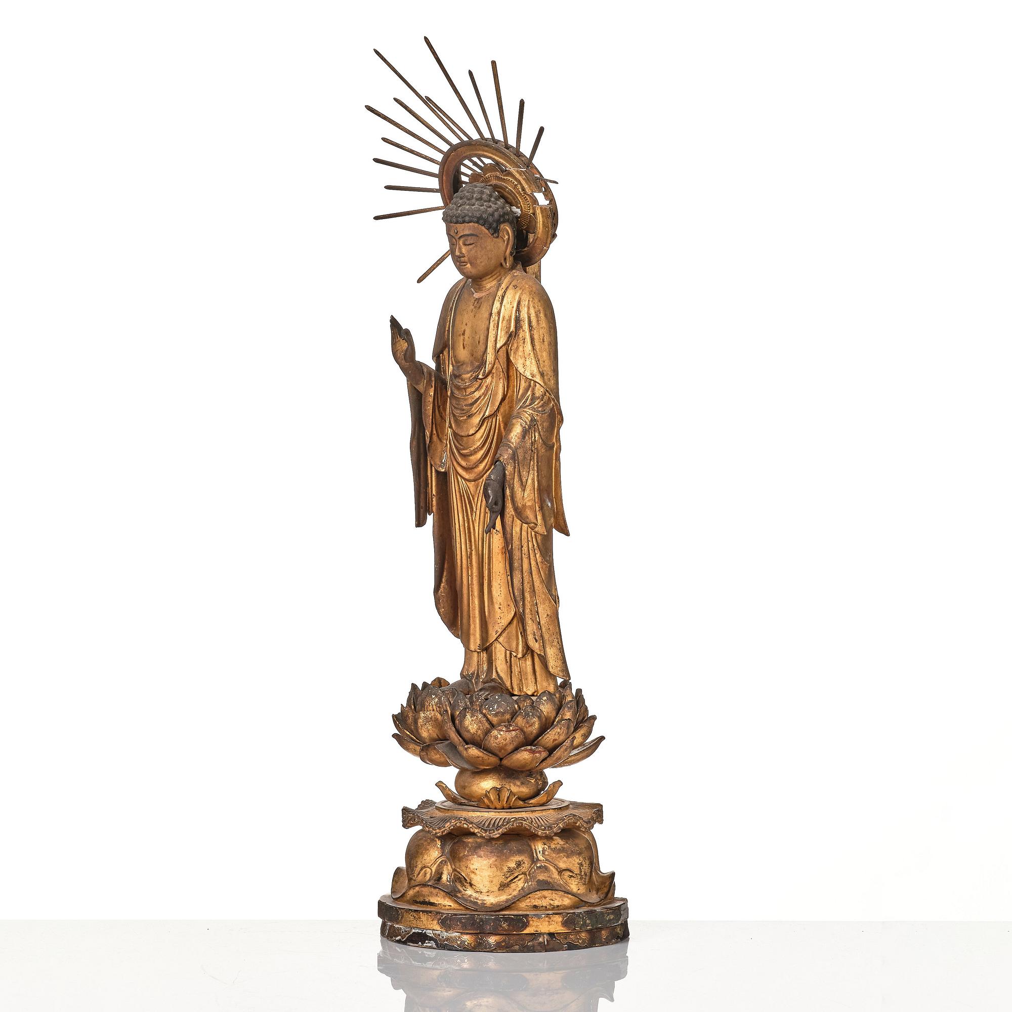 A Japanese lacquer and gilt-decorated wood Amida Nyorai figure, 19th century.