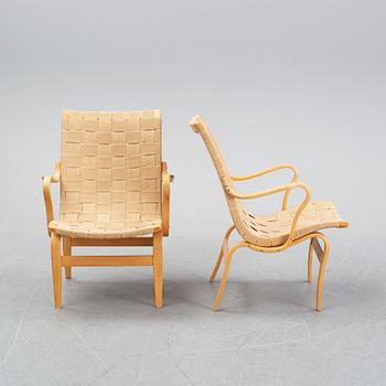 A pair of 'Eva' easy chairs by Bruno Mathsson for Firma Karl Mathsson, dated 1974.