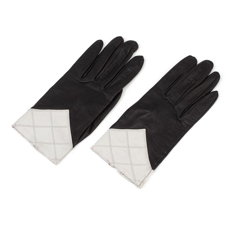 A pair of black-and white leather gloves by Chanel.