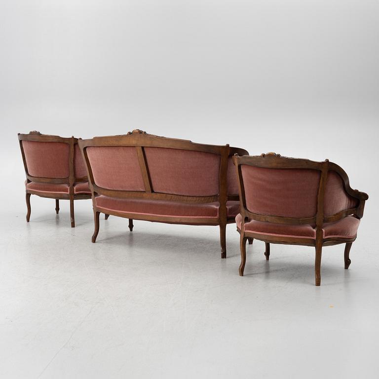 Sofa, 2 armchairs, 4 chairs, table and banquet, Rococo style, 20th century.