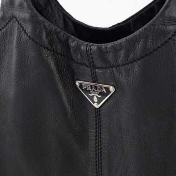Prada, A black leather bag.