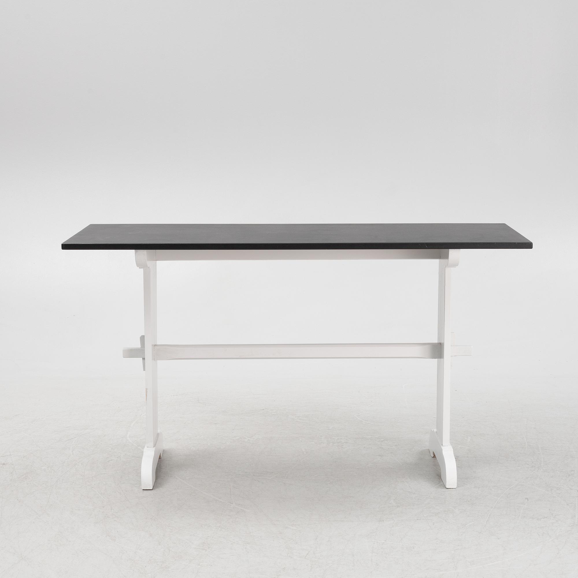 A painted table, 20th Century.