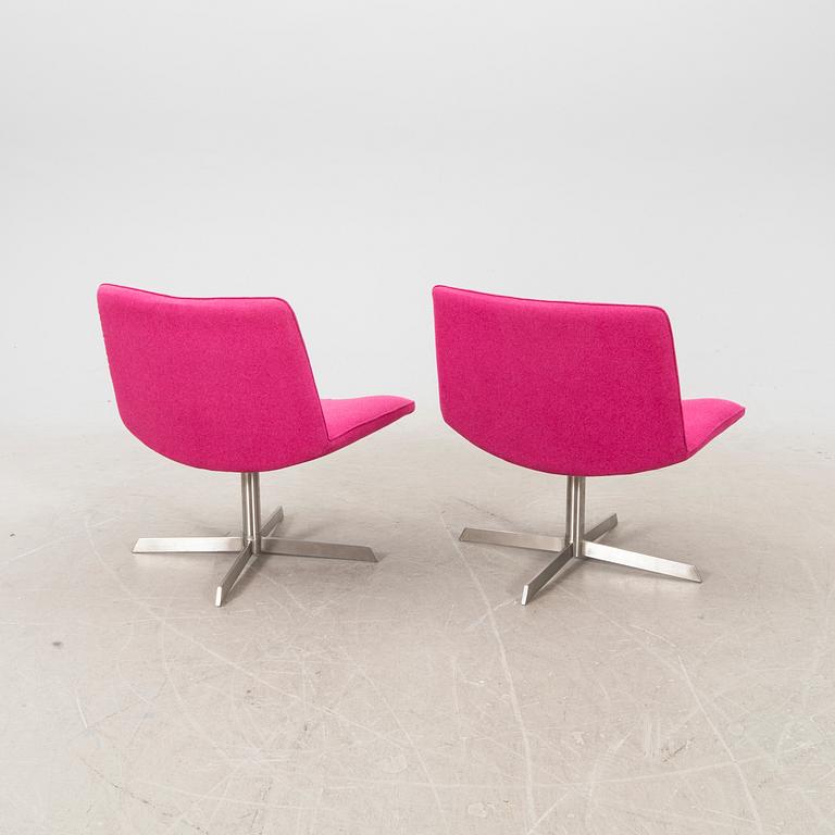 A pair of Corvette Fine Design easy chairs 21st century.