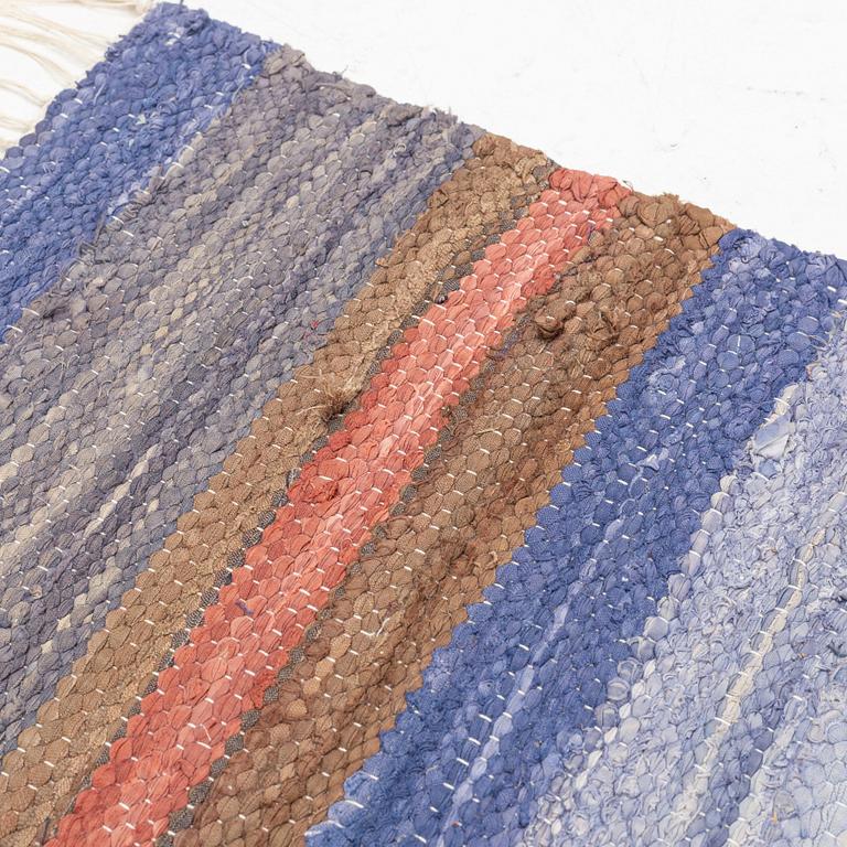 A rag rug, c. 300 x 195 cm.