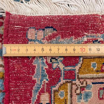 A Kirman carpet, signed, c. 388 x 279 cm.