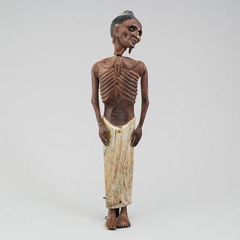 A wooden sculpture of a indian man, early 20th Century.