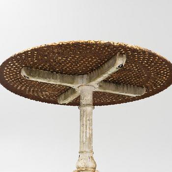 A cast iron garden table, first half of the 20th Century.