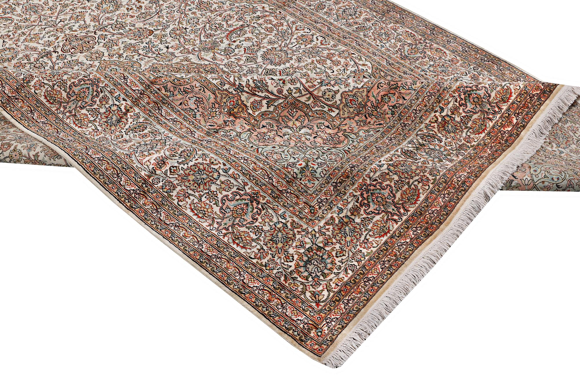 A carpet, silk Kashmir, ca 303 x 216 cm.
