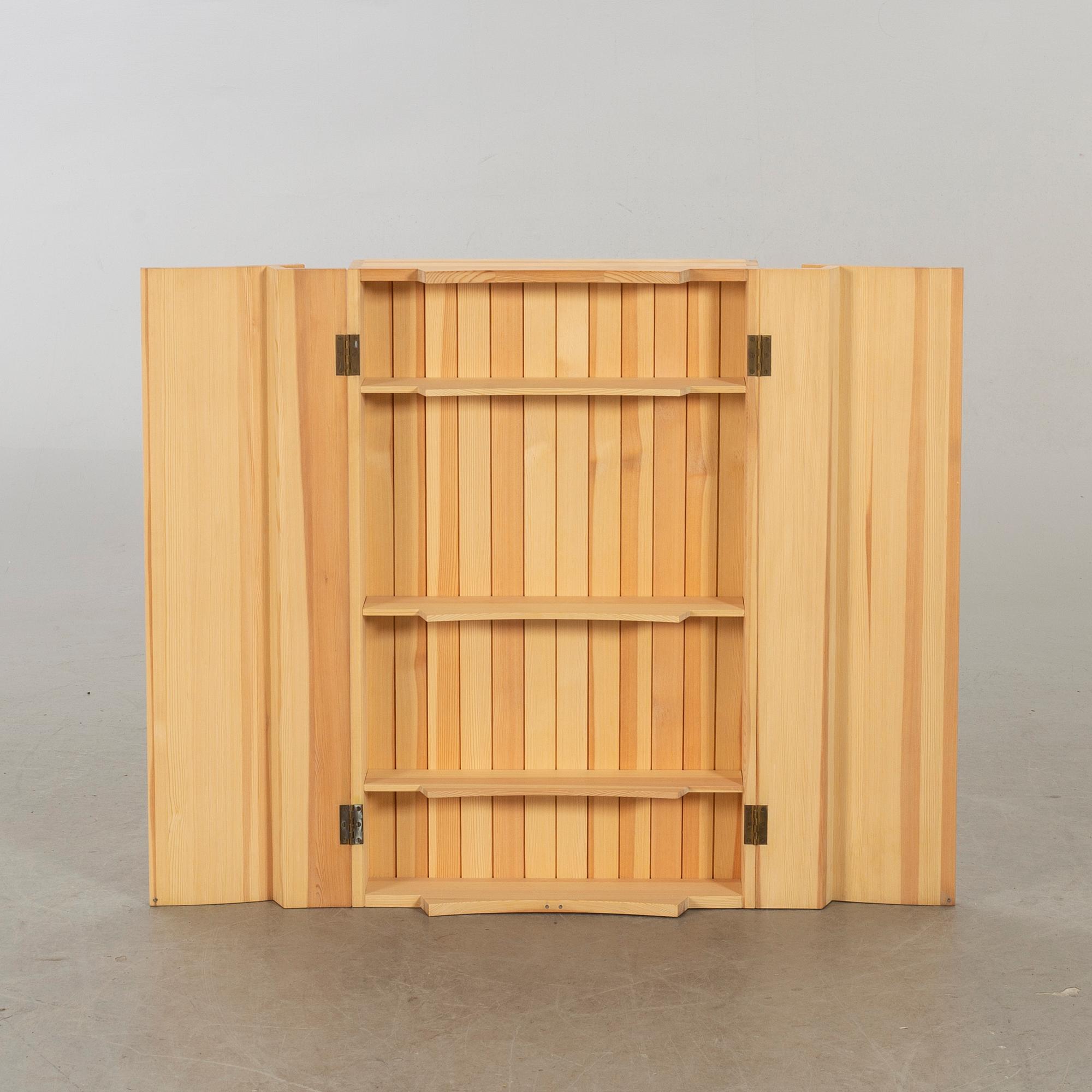 OLOF PIRA, A PINEWOOD WALL CUPBOARD DESIGN OLOF PIRA.