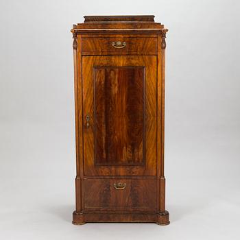 A Late Empire cabinet from the second quarter of the 19th century.