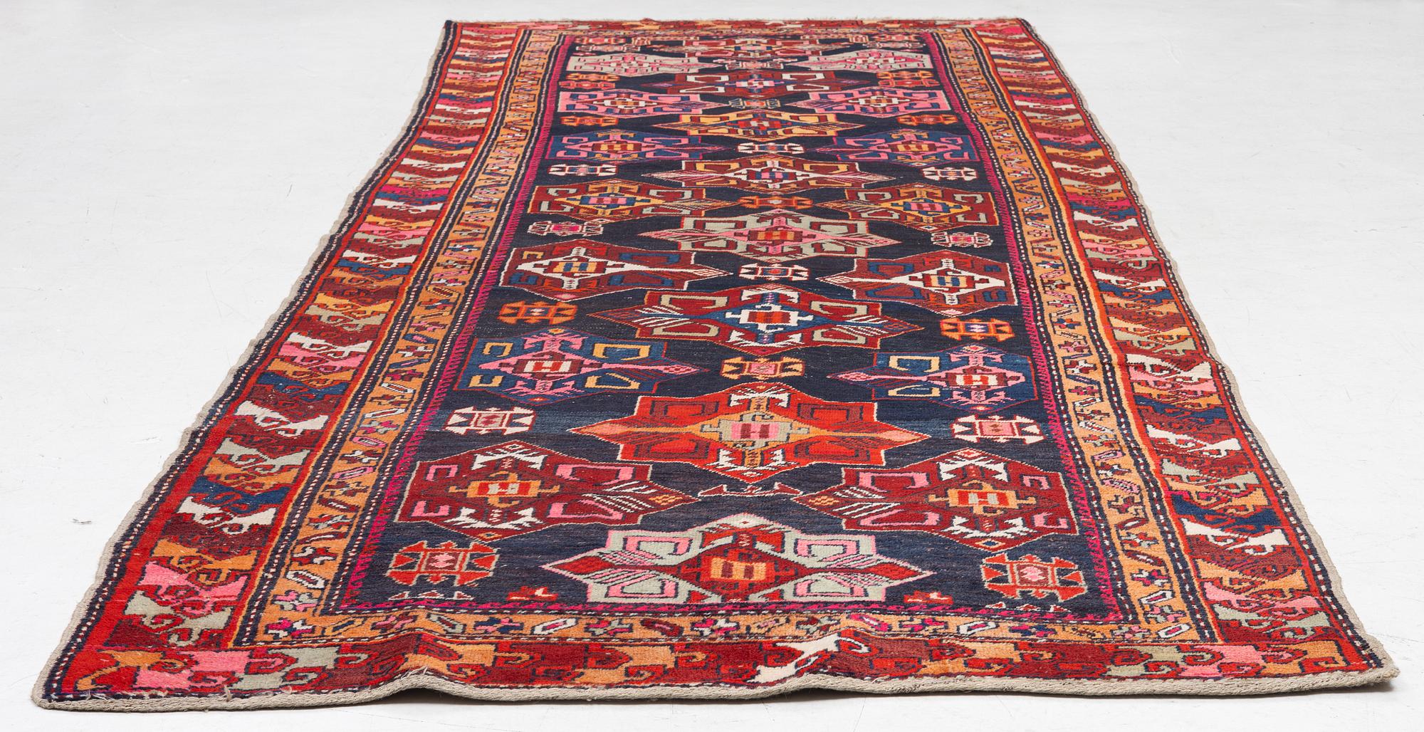 A semi-antique Anatolian runner, c. 409 x 159 cm.