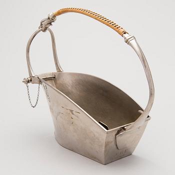 A metal wine bottle stand from WMF, Geislingen, Germany first half of the 20th Century.