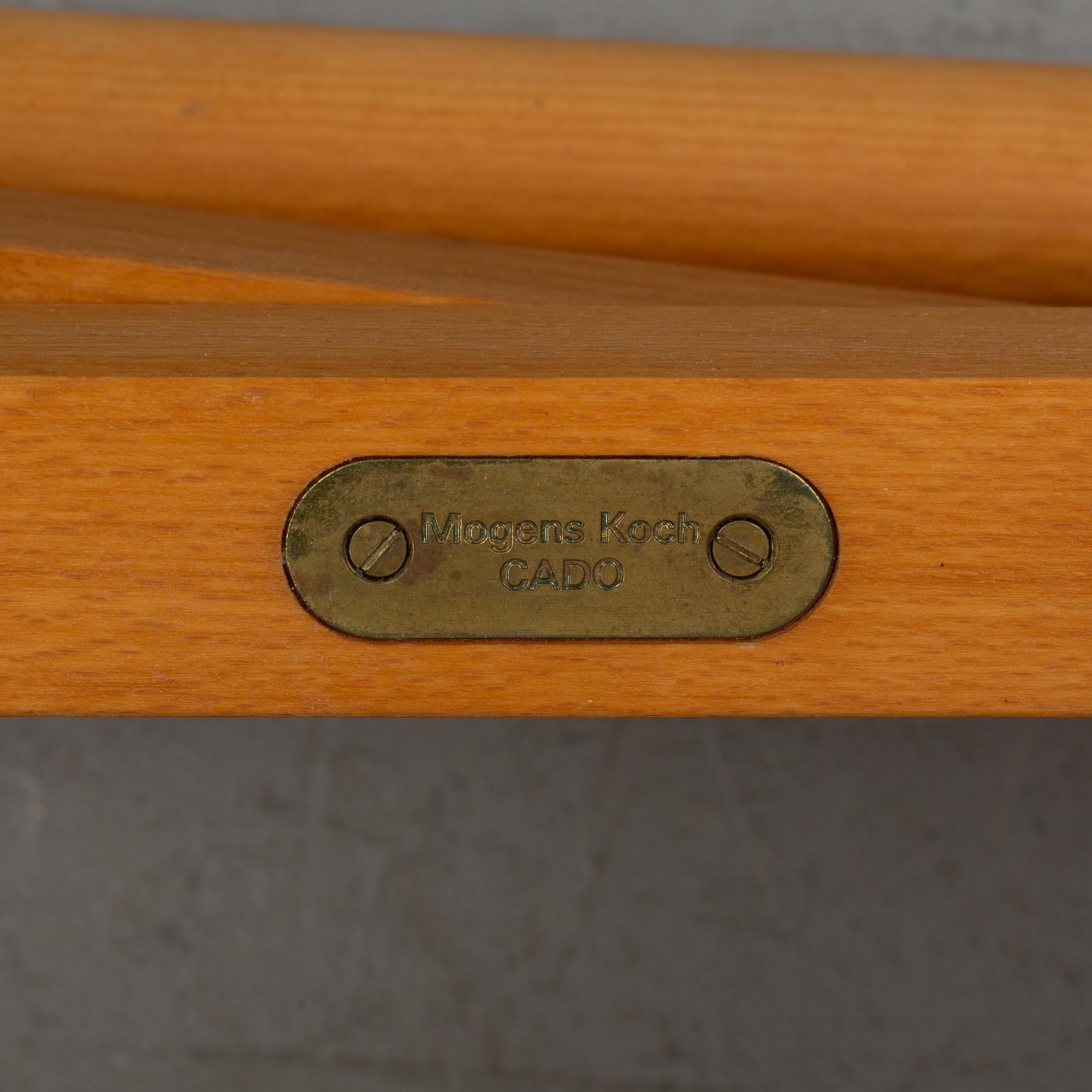 Mogens Koch, a set of four folding chairs, Kado, late 20th century.