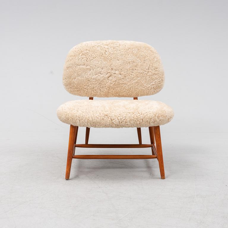 A TeVe easy chair by Alf Svensson, with new sheepskin upholstery, Studio Ljungs Industrier, 1950's.
