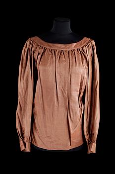 394. A set of two blouses by Yves Saint Laurent.