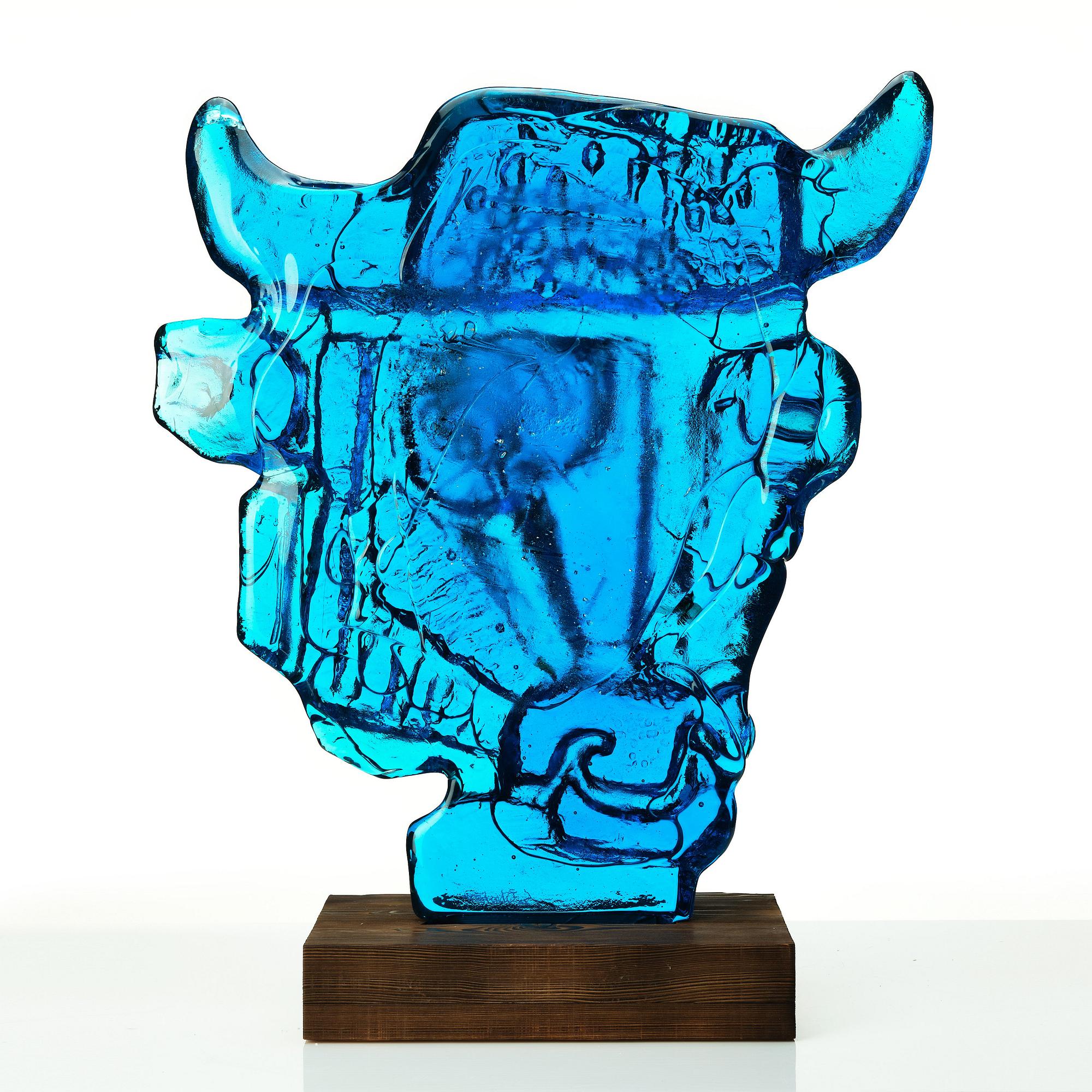 Edvin Öhrström, a blue/ turquoise coloured cast glass sculpture of a bull's head, Lindshammar glassworks, Sweden, signed and dated 1953.