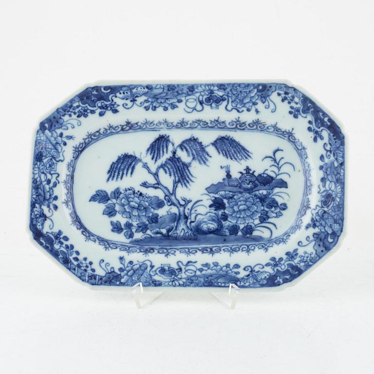 Two blue and white porcelain serving dishes and a stand for a butter tureen, China, Qianlong (1736-95).