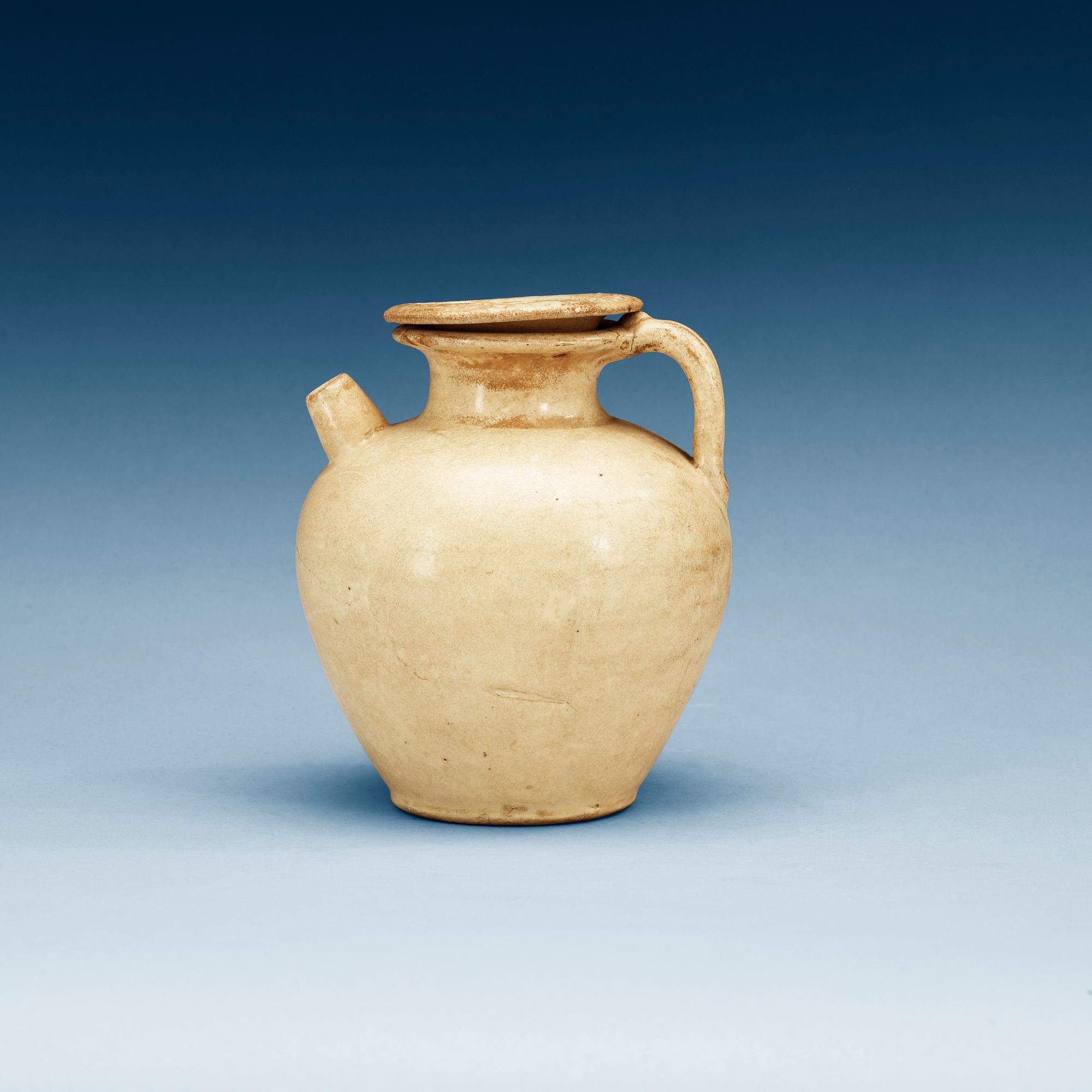 A cream glazed ewer with cover, Tang dynasty (618-907).