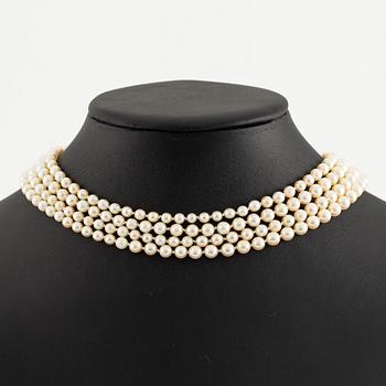 Multi-strand pearl necklace with a clasp/brooch in gold with diamonds,.